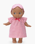 Minikane - Maia at home in her pink checkered nightgown