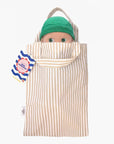 Minikane - Zebulon at the beach in his blue striped outfit