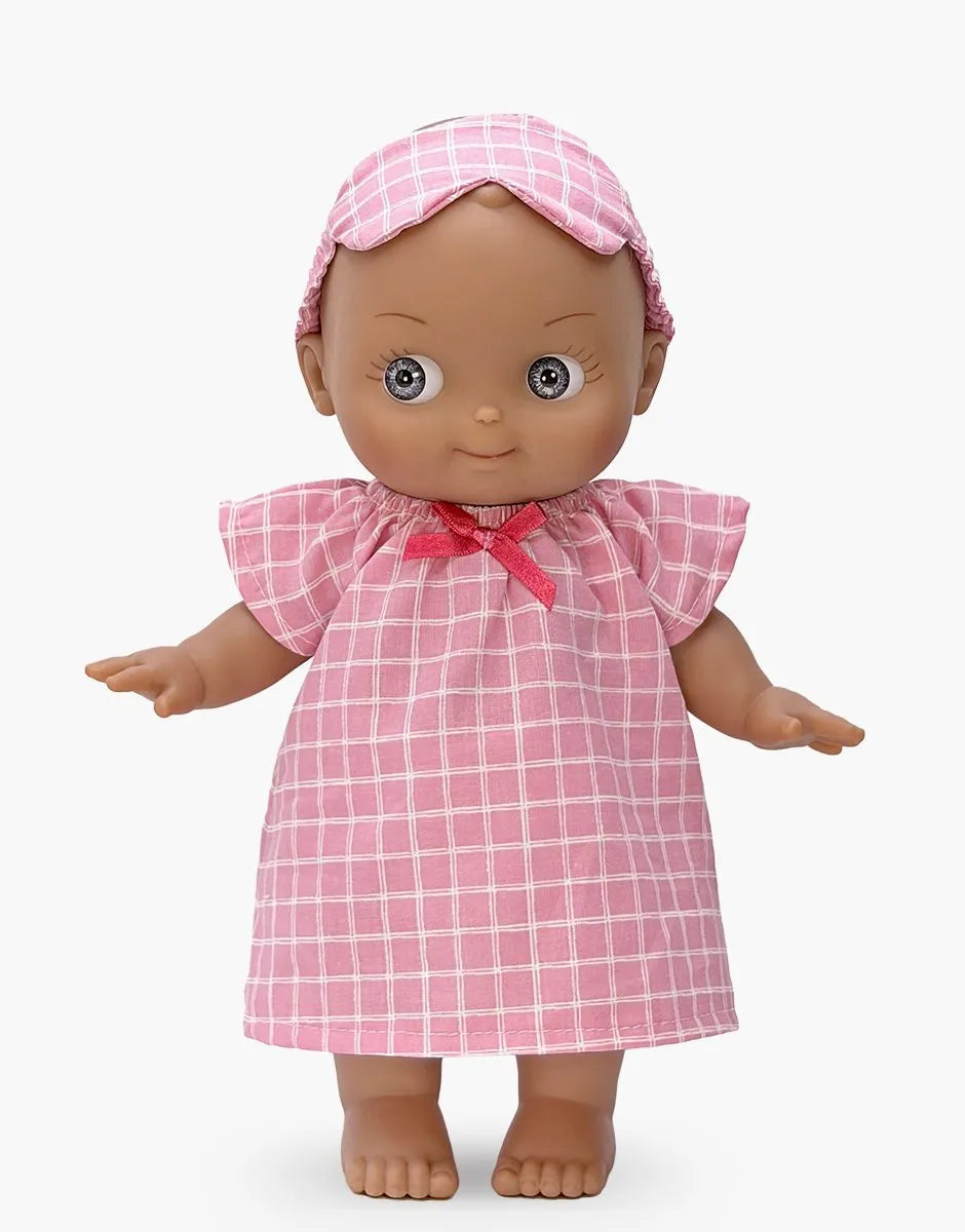 Minikane - Maia at home in her pink checkered nightgown