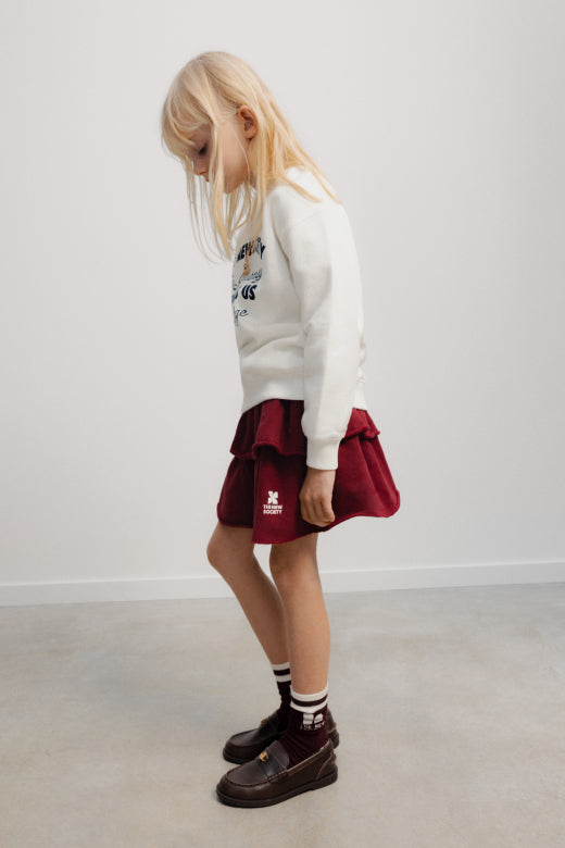 The New Society - TNS logo skirt - rumba red