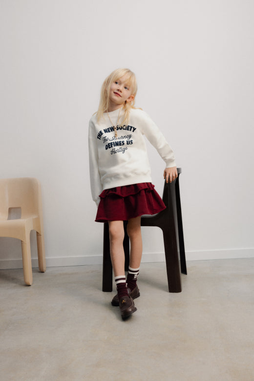 The New Society - TNS logo skirt - rumba red